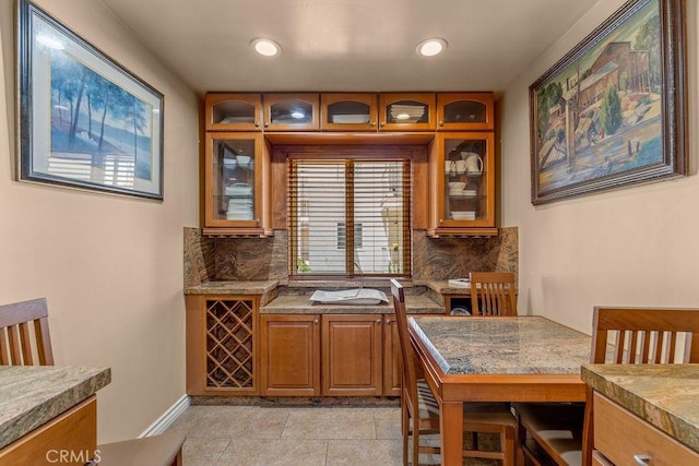 1344 5th St Unit 7, Glendale, CA 91201 - kitchen featuring tasteful backsplash, brown cabinetry, glass insert cabinets, and recessed lighting