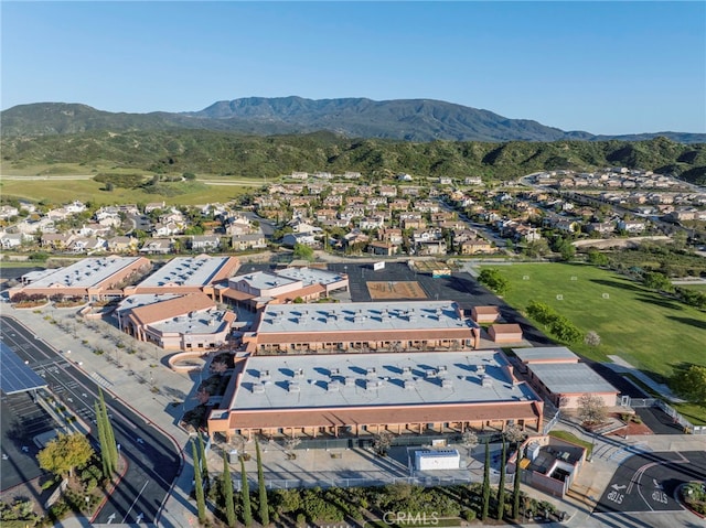 birds eye view of property with a mountain view