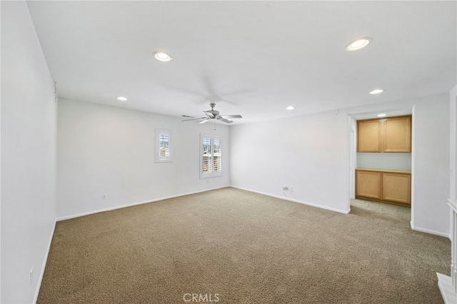 unfurnished room featuring light carpet, baseboards, ceiling fan, and recessed lighting