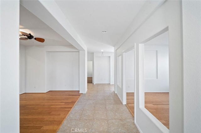 hallway with baseboards and recessed lighting