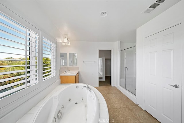 bathroom featuring a jetted tub, a stall shower, tile patterned floors, visible vents, and vanity