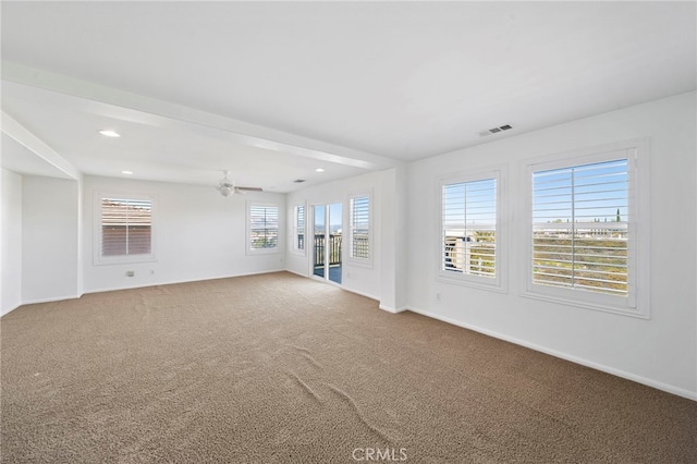 unfurnished living room featuring baseboards and carpet