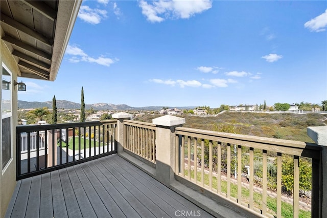 wooden deck featuring a mountain view