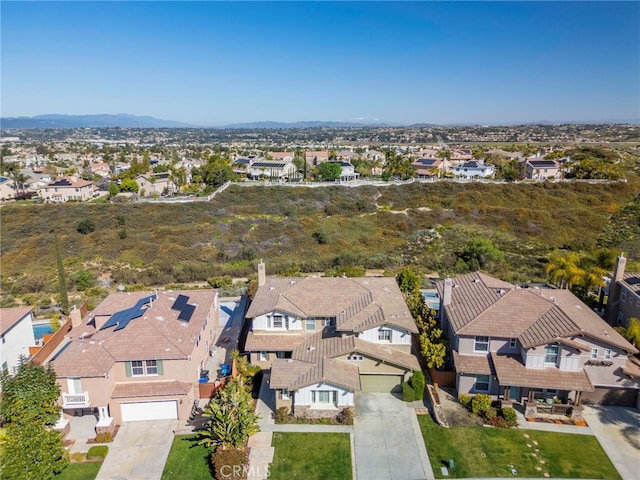 drone / aerial view with a residential view and a mountain view