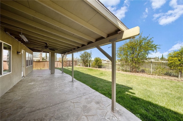 view of patio featuring a fenced backyard and ceiling fan