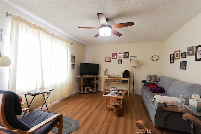 12592 Arlington Pl, Chino, CA 91710 - living area featuring ceiling fan, wood finished floors, and a textured ceiling