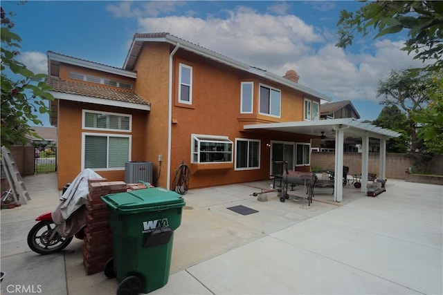 12592 Arlington Pl, Chino, CA 91710 - rear view of property with a fenced backyard, stucco siding, a patio area, a chimney, and central air condition unit
