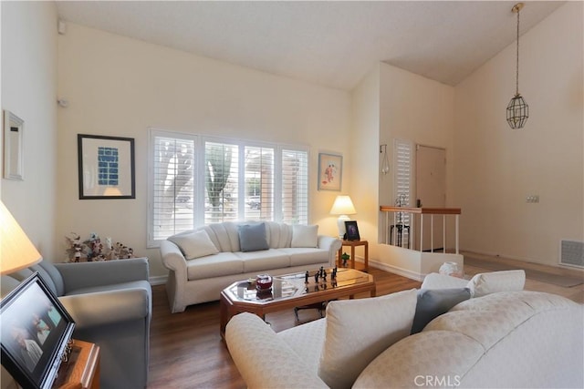 12592 Arlington Pl, Chino, CA 91710 - living room featuring wood finished floors, baseboards, and high vaulted ceiling