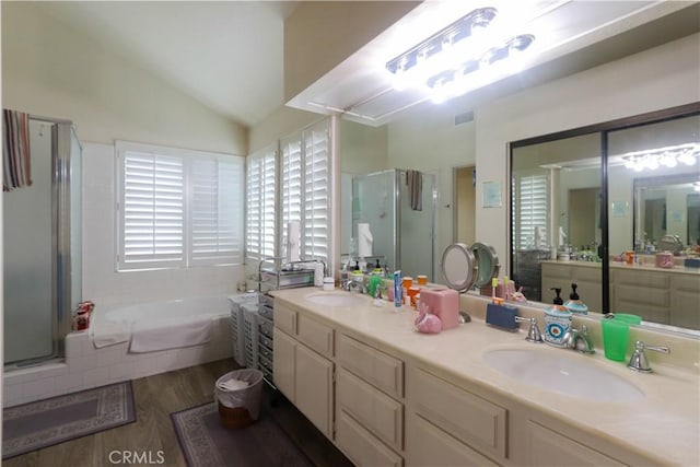 12592 Arlington Pl, Chino, CA 91710 - full bath with a stall shower, a garden tub, double vanity, wood finished floors, and vaulted ceiling