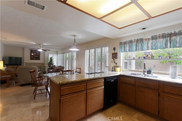 12592 Arlington Pl, Chino, CA 91710 - kitchen featuring dishwasher, a peninsula, a sink, brown cabinetry, and a ceiling fan