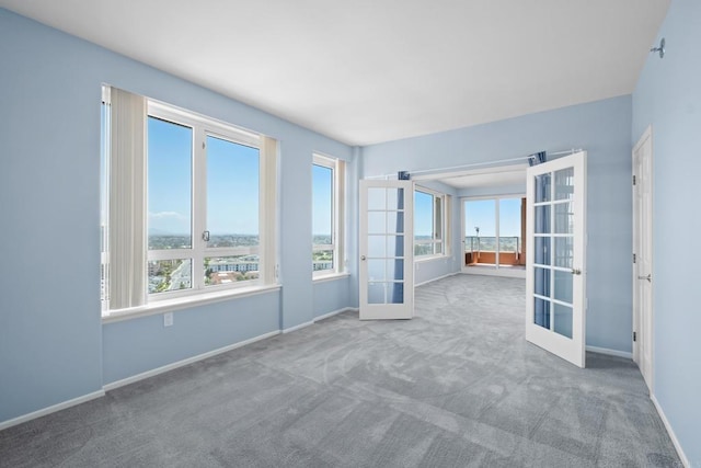 3890 Nobel Dr Unit 1706, San Diego, CA 92122 - carpeted empty room featuring french doors and baseboards