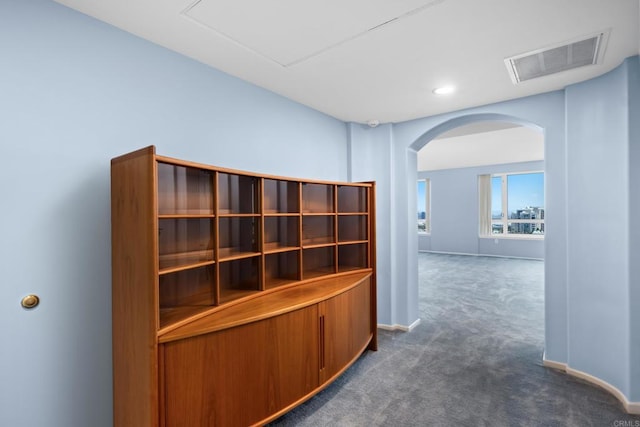 3890 Nobel Dr Unit 1706, San Diego, CA 92122 - corridor with dark carpet, arched walkways, baseboards, and recessed lighting