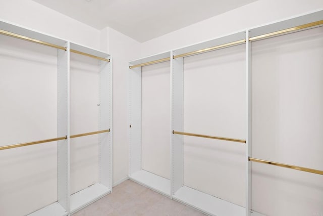 3890 Nobel Dr Unit 1706, San Diego, CA 92122 - walk in closet featuring light tile patterned floors