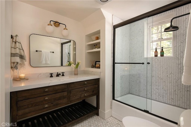 920 Oak Rd, Lake Arrowhead, CA 92385 - full bath featuring toilet, tile patterned floors, enclosed tub / shower combo, vanity, and built in features
