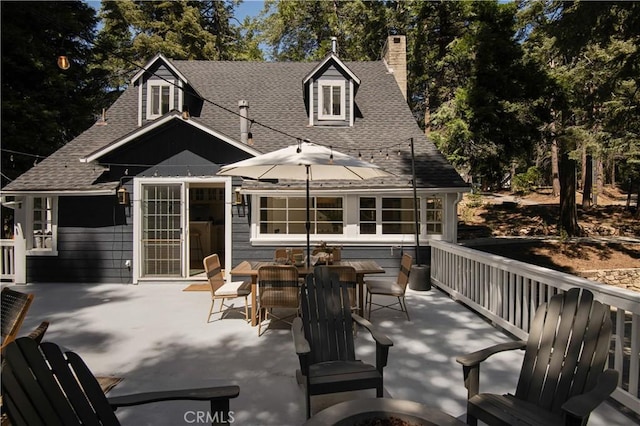 920 Oak Rd, Lake Arrowhead, CA 92385 - rear view of property with a patio, roof with shingles, a chimney, and outdoor dining space