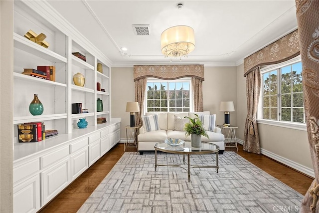 67 W Wistaria Ave, Arcadia, CA 91007 - living area featuring plenty of natural light, baseboards, ornamental molding, built in features, and dark wood finished floors