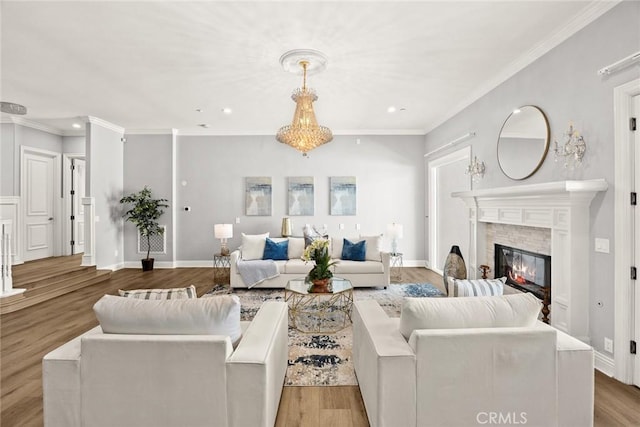 67 W Wistaria Ave, Arcadia, CA 91007 - living room with recessed lighting, a glass covered fireplace, crown molding, wood finished floors, and baseboards