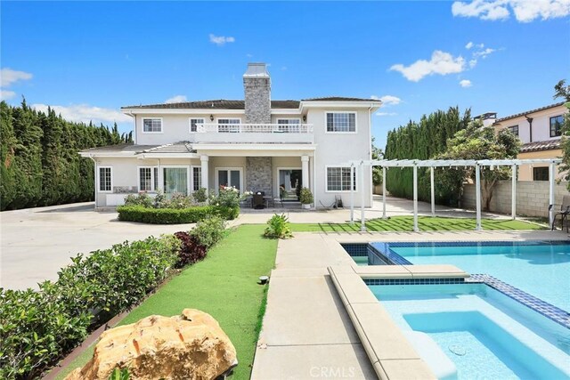 67 W Wistaria Ave, Arcadia, CA 91007 - rear view of property featuring a balcony, a chimney, stucco siding, fence, and a pergola