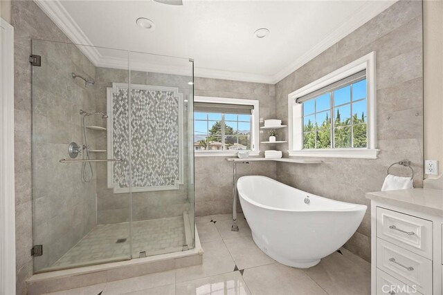 67 W Wistaria Ave, Arcadia, CA 91007 - bathroom featuring a stall shower, crown molding, a freestanding bath, tile patterned floors, and tile walls
