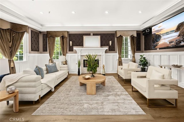 67 W Wistaria Ave, Arcadia, CA 91007 - living area with a decorative wall, wainscoting, dark wood-type flooring, crown molding, and a glass covered fireplace