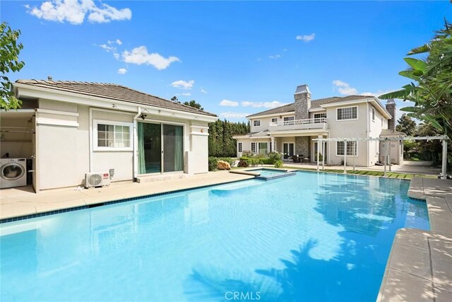 67 W Wistaria Ave, Arcadia, CA 91007 - view of pool featuring washer / clothes dryer, a pool with connected hot tub, a cooling unit, and a patio area