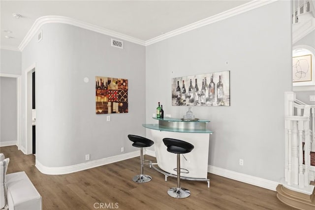 67 W Wistaria Ave, Arcadia, CA 91007 - bar with wood finished floors, crown molding, and baseboards