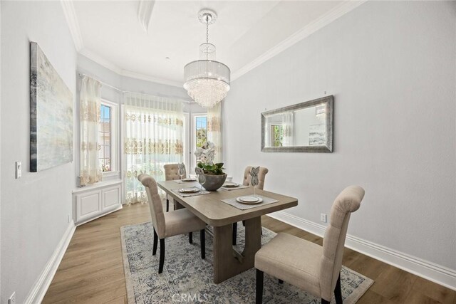 67 W Wistaria Ave, Arcadia, CA 91007 - dining space featuring a chandelier, plenty of natural light, wood finished floors, baseboards, and ornamental molding