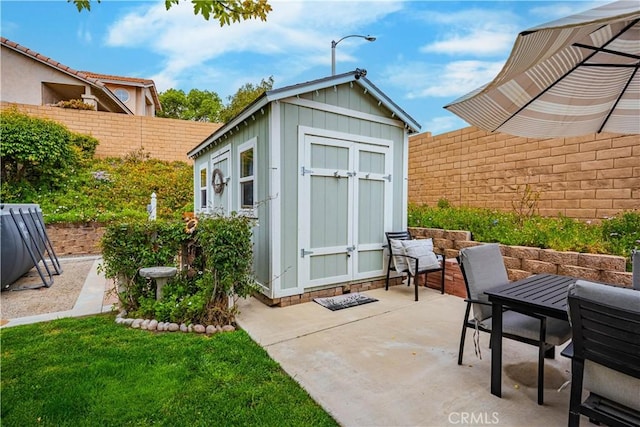 view of shed featuring a fenced backyard