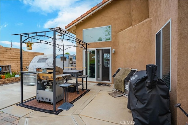 view of patio / terrace with fence
