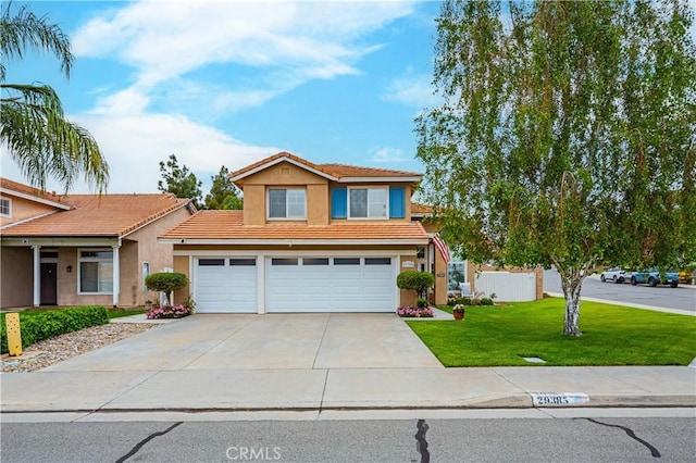 traditional-style home featuring a garage, a tiled roof, stucco siding, a front lawn, and driveway