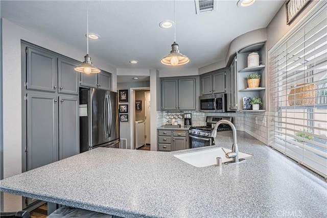 kitchen with a sink, gray cabinets, open shelves, visible vents, and appliances with stainless steel finishes