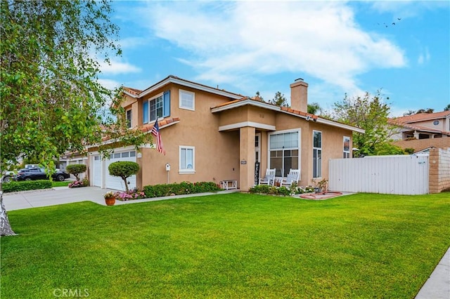 view of front of home featuring a chimney, driveway, fence, stucco siding, and a front yard