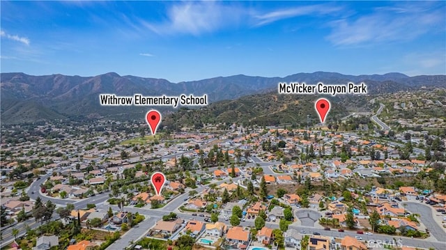 drone / aerial view featuring a mountain view and a residential view