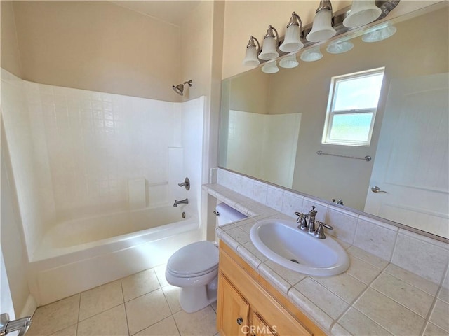 bathroom with toilet, tile patterned floors, vanity, and shower / tub combination