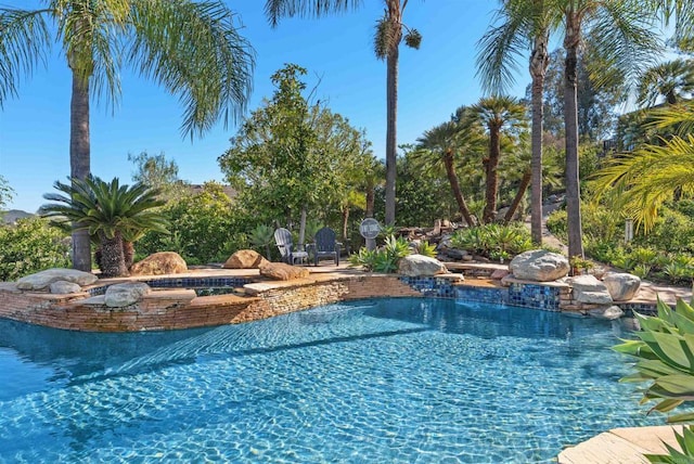 pool with an in ground hot tub