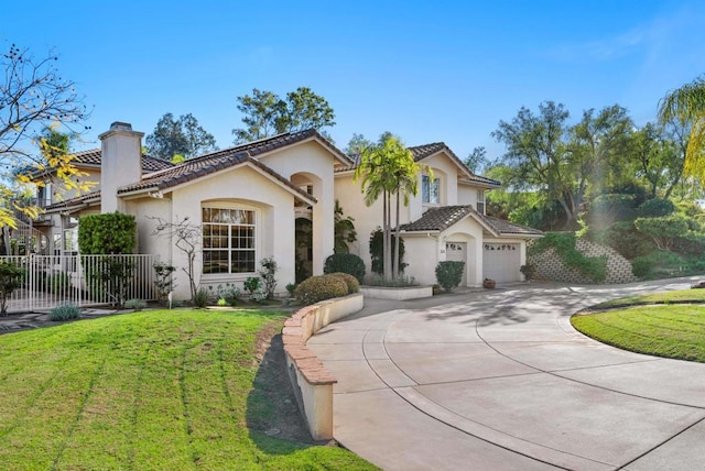 mediterranean / spanish home with a chimney, fence, stucco siding, a tile roof, and curved driveway