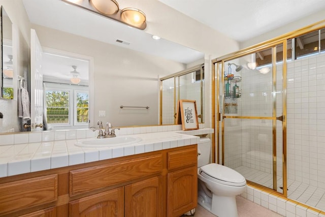 full bathroom with a shower stall, toilet, vanity, and visible vents