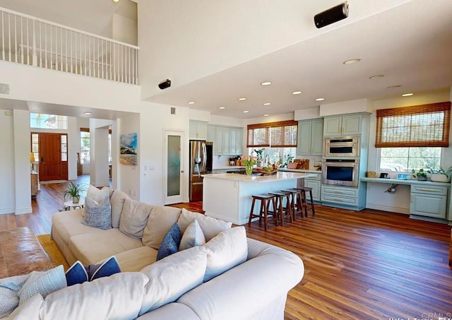2034 Ridgecrest Pl, Escondido, CA 92029 - living area with plenty of natural light, wood finished floors, a towering ceiling, and recessed lighting