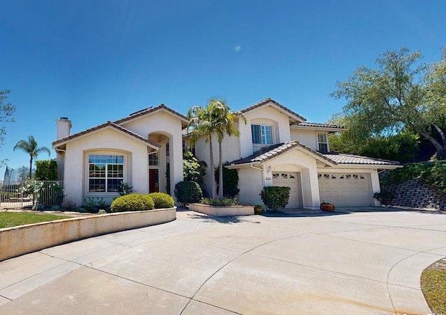 2034 Ridgecrest Pl, Escondido, CA 92029 - mediterranean / spanish house featuring a chimney, stucco siding, driveway, and an attached garage