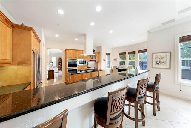 6312 Camino Marinero, San Clemente, CA 92673 - kitchen featuring island range hood, stainless steel appliances, recessed lighting, plenty of natural light, and dark stone counters