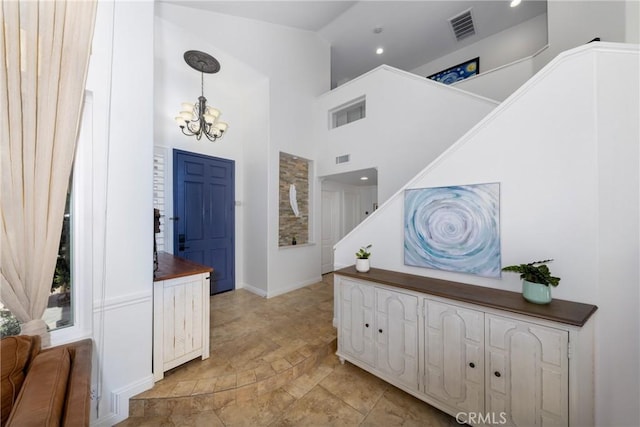 5530 Van Gogh Way, Yorba Linda, CA 92887 - entrance foyer with a chandelier, a towering ceiling, light stone finish flooring, stairs, and recessed lighting