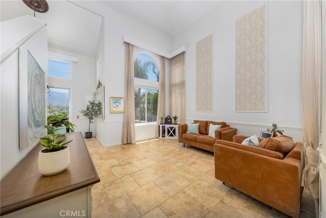 5530 Van Gogh Way, Yorba Linda, CA 92887 - living area featuring a high ceiling and light stone finish flooring