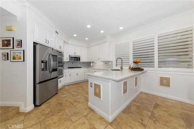 5530 Van Gogh Way, Yorba Linda, CA 92887 - kitchen with stainless steel appliances, a peninsula, white cabinets, decorative backsplash, and crown molding
