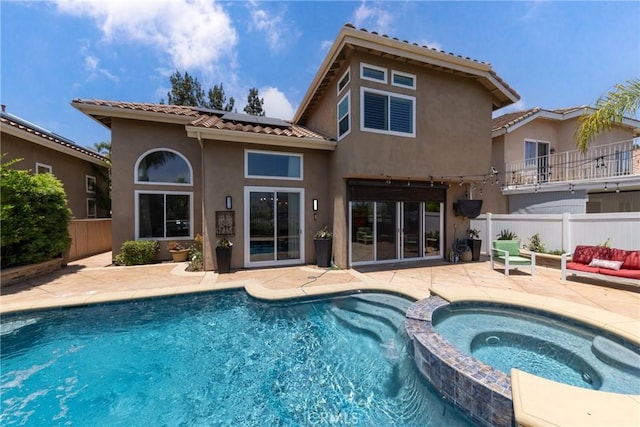 5530 Van Gogh Way, Yorba Linda, CA 92887 - rear view of property with roof mounted solar panels, a tile roof, stucco siding, a patio area, and a pool with connected hot tub