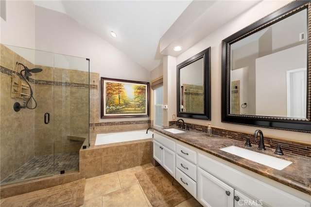 5530 Van Gogh Way, Yorba Linda, CA 92887 - bathroom with vaulted ceiling, a bath, a shower stall, double vanity, and tile patterned floors