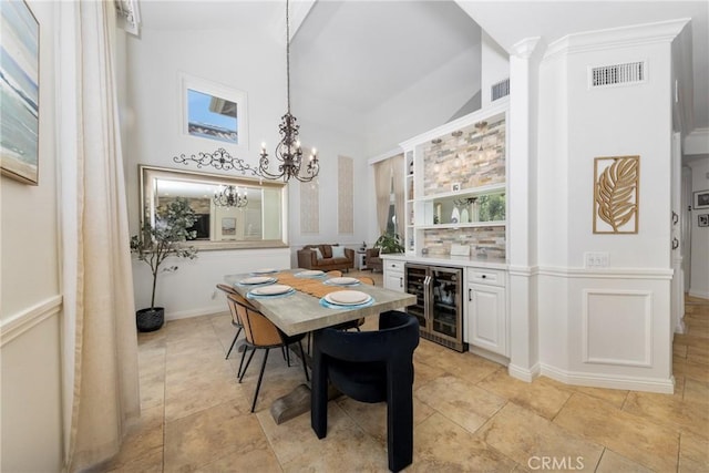 5530 Van Gogh Way, Yorba Linda, CA 92887 - dining space featuring beverage cooler, a chandelier, a dry bar, and a high ceiling