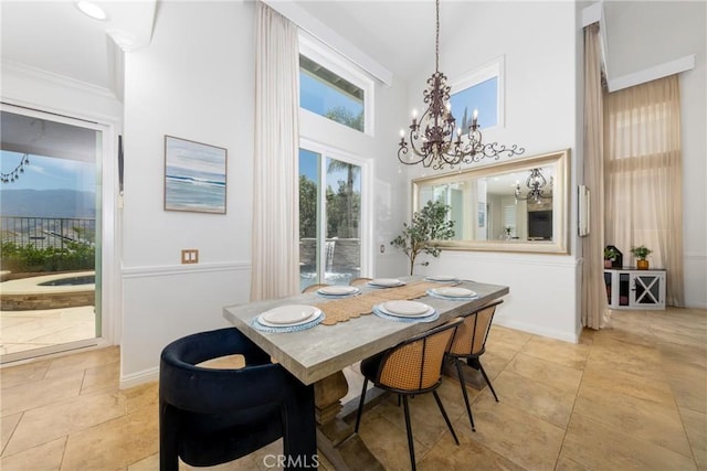 5530 Van Gogh Way, Yorba Linda, CA 92887 - dining space with a chandelier, a towering ceiling, and light tile patterned floors