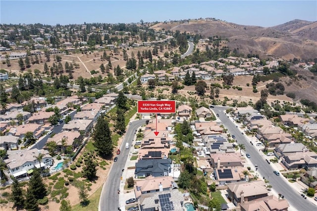 5530 Van Gogh Way, Yorba Linda, CA 92887 - aerial view of property's location featuring a mountainous background and nearby suburban area