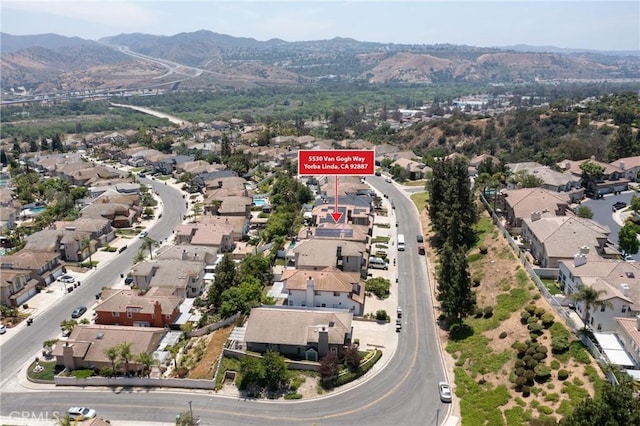 5530 Van Gogh Way, Yorba Linda, CA 92887 - aerial overview of property's location featuring nearby suburban area and a mountainous background