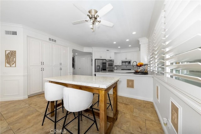 5530 Van Gogh Way, Yorba Linda, CA 92887 - kitchen featuring stainless steel appliances, light countertops, white cabinets, recessed lighting, and ceiling fan